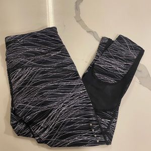 Nike dri fit cropped leggings with abstract design and mesh calf detail. Size M